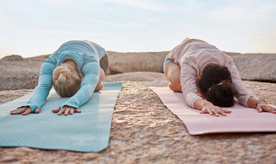 Sticker - Yoga, women or childs pose on beach mat in workout, training or bonding exercise for back pain. Relax, stretching or yogi friends in nature pilates, fitness flexibility or healthcare wellness on rock