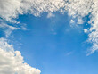 Abstract nature background of white cloud around the border and blue sky in the center, space for text