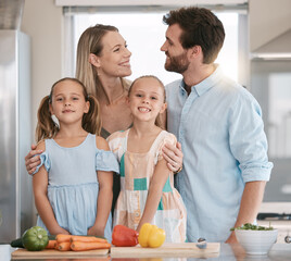 Wall Mural - Parents, food and portrait of children cooking with vegetables for lunch, dinner or ingredients for meal prep. Family, smile and mom, dad and girls learning, teaching and helping at kitchen table