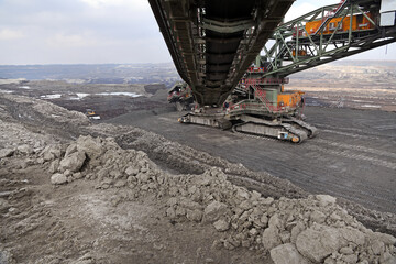 Wall Mural - Bucket-wheel excavator during excavation at the surface mine. Huge excavator on open pit mine.