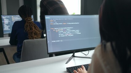 data scientist and front-end web developer in office, woman writing program code, software testers