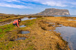 © Noppasinw - Jeju Island South Korea, nature landscape at Seongsan Ilchulbong with tourist woman