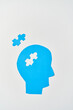 Alzheimer's disease, senile dementia and memory loss. Head silhouette with jigsaw puzzle