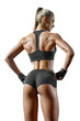 © USM Photography - Back muscles of young female athlete bodybuilder. Perfect fit and muscular female body. Fitness woman turning back
