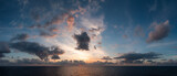 Fototapeta Pomosty - Dramatic Colorful Sunset Sky over Mediterranean Sea. Clouds with Sunrays. Cloudscape Nature Background. Panorama