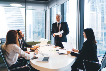 Wall Mural - Group of diverse coworkers having conversation in office together