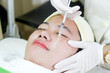 Close up of attractive women lying and beauty saloon, undergoing acne treatment with injections. An effective remedy for acne