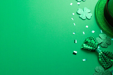 Wall Mural - image of green hat, clover and copy space on green background