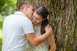 © Andriy Petrenko - Happy young couple in love outdoors in park