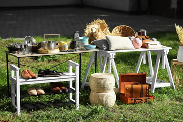 Wall Mural - Small tables with many different items on garage sale in yard