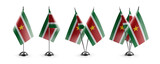 Fototapeta Boho - Small national flags of the Suriname on a white background
