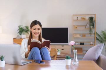Wall Mural - Working lifestyle at home concept, Women reading holy bible after working at modern home office