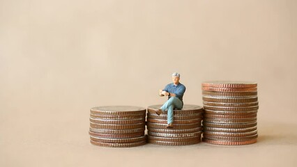 Wall Mural - Miniature people , Stop motion animation Raising of coins , Money saving and economy Concept.
