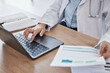 © C. D./peopleimages.com - Hands, doctor on laptop or woman reading online medical research data, email or healthcare medicine report. Science, documents or paper on tech for hospital schedule, surgery agenda or compliance