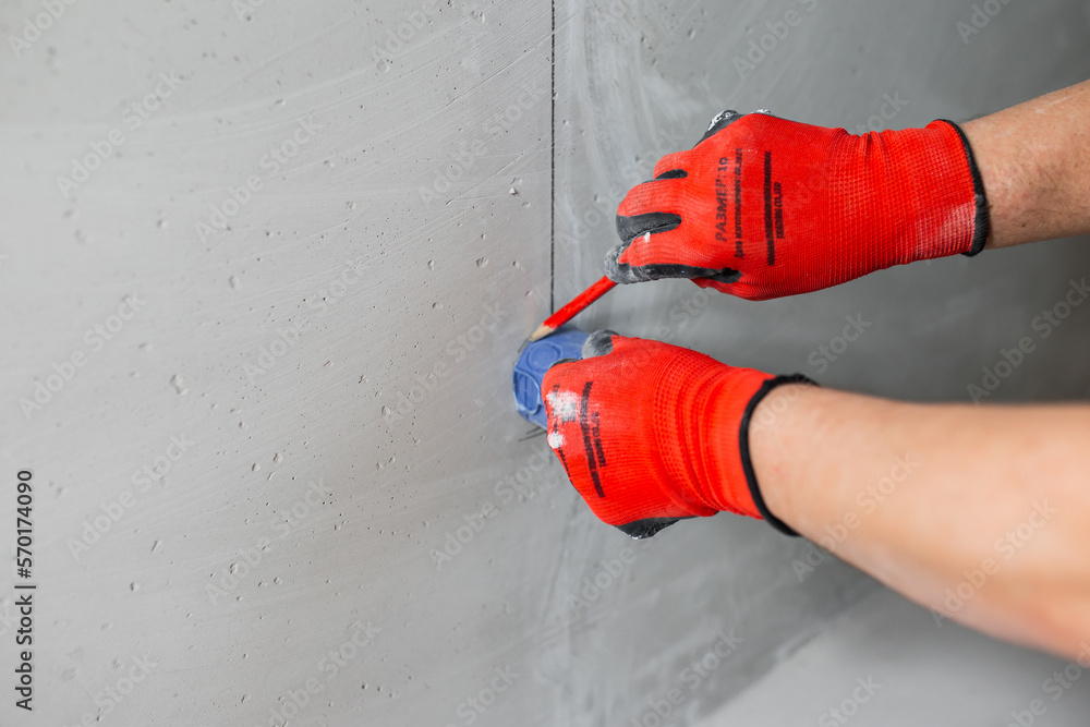 Installation and transfer of a place for an electrical outlet in a concrete wall with a cable recess in a hidden strobe