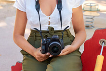 Close-up Of A Young Woman Holding A Camera