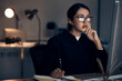 © Clayton D/peopleimages.com - Woman, night office and writing at computer for seo planning, research or agenda in dark startup. Female working overtime on desktop technology, online notes and network data for internet analytics