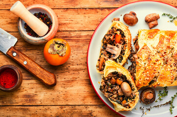 Wall Mural - Homemade savoury mushroom pie with and persimmon