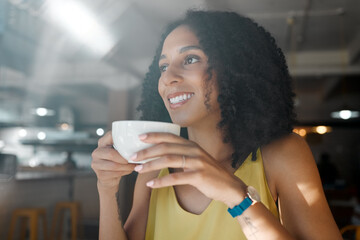 Wall Mural - Morning cup of tea, black woman and coffee shop thinking with a young person in a restaurant. Cafe, sitting and happy African female with a hot drink enjoying a day with happiness and an idea