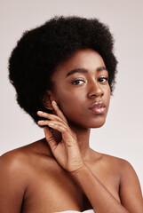 Poster - Portrait, natural or skincare and a model black woman in studio on a gray background with afro hair. Skin, cosmetics and beauty with an attractive young female posing indoor for health or wellness