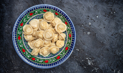 Wall Mural - dumpling uzbek cuisine. Uzbek food Manti or dumplings. Homemade Uzbek dish. Long banner format. top view