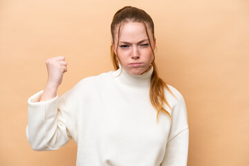 Canvas Print - Young caucasian woman isolated on beige background with unhappy expression