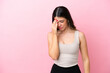 Young Italian woman isolated on pink background with headache