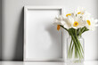 © Lasvu - Empty portrait picture frame mockup on white shelf with flowers. Generative AI