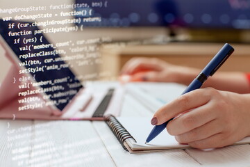 woman programmer write down code on paper