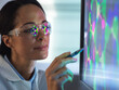 © Connect Images - Close-up of scientist designing chemical formula