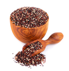 Wall Mural - Quinoa seeds in wooden bowl and spoon, isolated on white background. Mix of white, red and black quinoa.