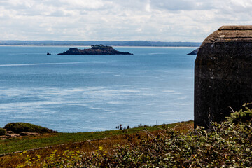 Wall Mural - Bunker with GR34 sign at Pointe du Grouin, Brittany France