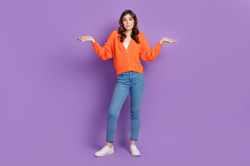 Wall Mural - Full body length photo of young funny unsure no idea woman wearing stylish outfit shrug shoulders dont know isolated on purple color background