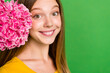 Close up cropped portrait of nice peaceful girl beaming smile fresh flower empty space isolated on green color background