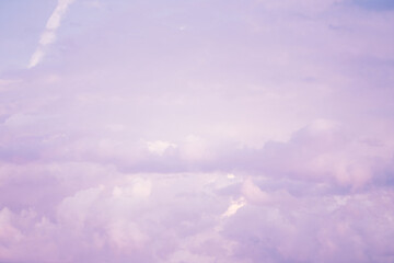 Wall Mural - Sky with soft and fluffy pastel pink and blue colored clouds. Sunset background. Nature. sunrise. Instagram toned style