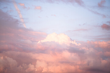 Wall Mural - Sky with soft and fluffy pastel pink and blue colored clouds. Sunset background. Nature. sunrise. Instagram toned style