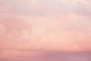 Wall Mural - Sky with soft and fluffy pastel pink and blue colored clouds. Sunset background. Nature. sunrise. Instagram toned style