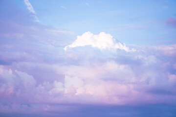 Wall Mural - Sky with soft and fluffy pastel pink and blue colored clouds. Sunset background. Nature. sunrise. Instagram toned style