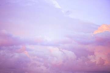 Wall Mural - Sky with soft and fluffy pastel lilac pink and blue colored clouds. Sunset background. Nature. sunrise. Instagram toned style