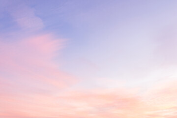 Wall Mural - Sky with soft and fluffy pastel pink and blue colored clouds. Sunset background. Nature. sunrise. Instagram toned style