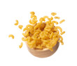 Macaroni fall on wooden bowl, yellow macaronis pasta float explode, abstract cloud fly. Curved macaroni pasta splash throwing in Air. White background Isolated high speed shutter, freeze motion