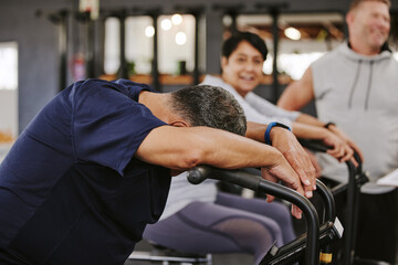 Wall Mural - Cardio, gym and tired senior man with energy, break and lose weight challenge in fitness class or club. Community support, running health and fatigue of people exercise, workout and training together