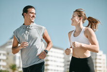 Couple, Fitness And Smile Running In The City For Exercise, Workout Or Cardio Routine Together In Cape Town. Happy Man And Woman Runner Taking A Walk Or Jog For Healthy Wellness Or Exercising Outside