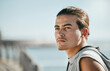 © Delcio/peopleimages.com - Thinking, fitness and young man at beach for cardio training, workout or running break on blue sky mockup. Calm, mindset and focus of athlete or sports person with exercise journey by ocean or sea