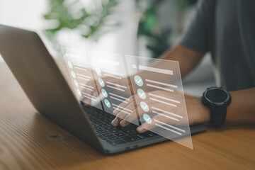 Leinwandbilder - A worker types on a laptop keyboard into a document management system (DMS) or database, which is the concept of using technology to effectively manage files and document storage in digital format..