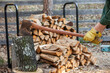 Person splitting log for firewood with Ax