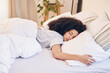 © Rene La/peopleimages.com - Black woman, relax and sleeping in home bedroom, tired or resting while dreaming. Peace, fatigue sleep and comfort of exhausted female, taking a nap with a comfortable pillow and blanket in her house