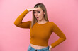 © luismolinero - Young caucasian woman isolated on pink background doing surprise gesture while looking to the side