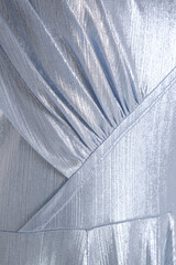 silver fabric with seams and pleats
