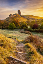 Sunrise At Corfe Castle In Dorset On A Beautiful Frosty Morning In Autumn.